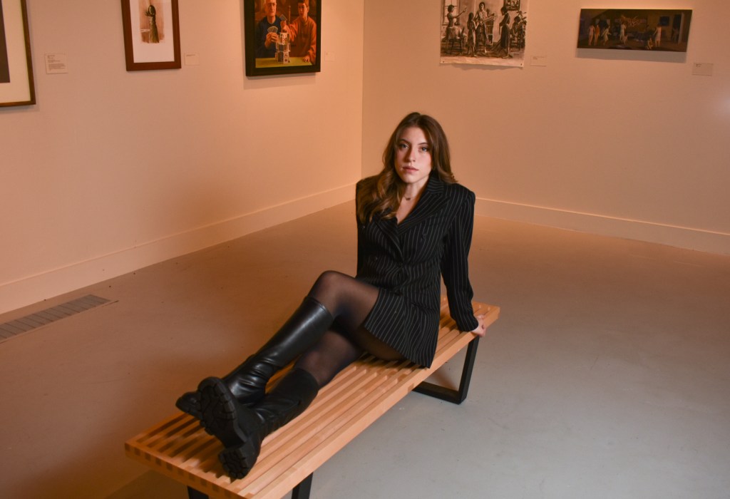 Anna Konen poses inside the Art Gallery on the campus of Central Michigan University, Tuesday, Nov. 15, 2022. Anna is studying fashion merchandising and enjoys modeling.