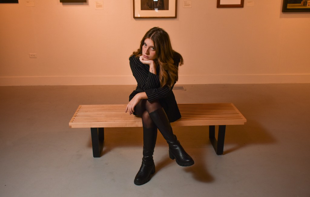 Anna Konen poses inside the Art Gallery on the campus of Central Michigan University, Tuesday, Nov. 15, 2022.