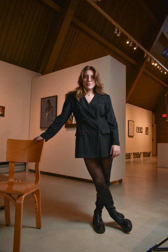 Anna Konen poses inside the Art Gallery on the campus of Central Michigan University, Tuesday, Nov. 15, 2022. Anna is studying fashion merchandising and enjoys modeling.