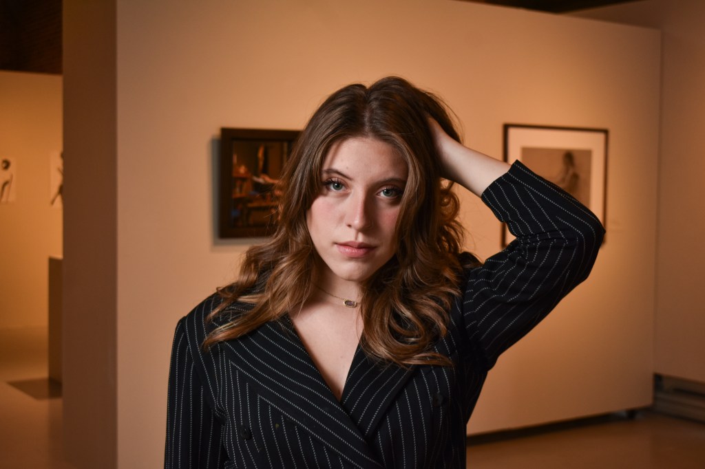Anna Konen poses inside the Art Gallery on the campus of Central Michigan University, Tuesday, Nov. 15, 2022.