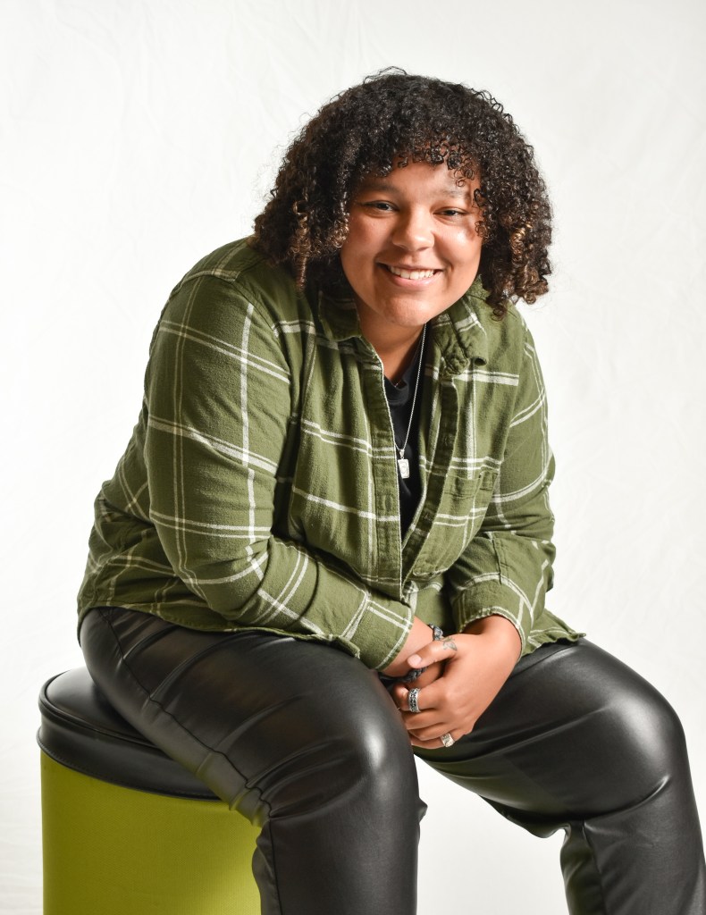 Caitlin Smith poses and pairs flannel with leather in Bovee University Center on the campus of Central Michigan University, Tuesday, Nov. 15, 2022.