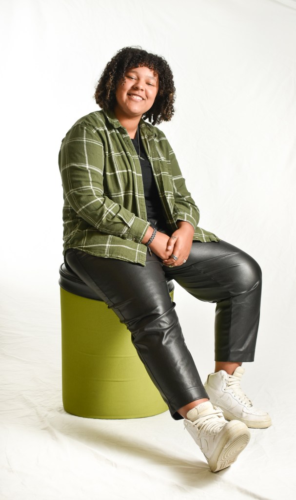 Caitlin Smith poses and pairs flannel with leather in Bovee University Center on the campus of Central Michigan University, Tuesday, Nov. 15, 2022.