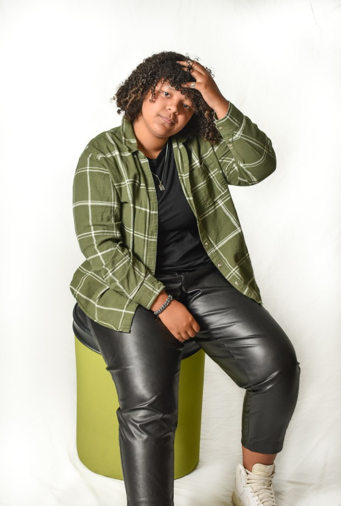 Caitlin Smith poses and pairs flannel with leather in Bovee University Center on the campus of Central Michigan University, Tuesday, Nov. 15, 2022.