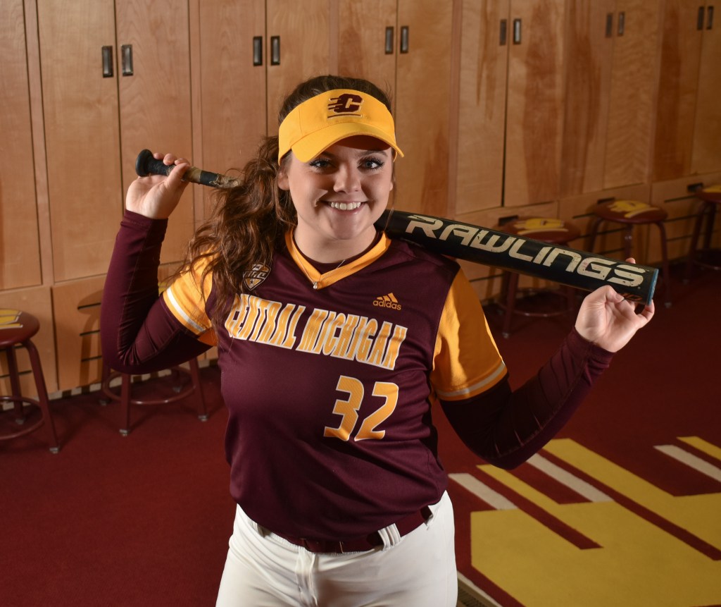 Katie Sexton poses in the CMU Women's Softball Lockerroom in Rose Arena on the campus of Central Michigan University, Sunday, Dec. 4, 2022. This is Katie's third year on the team.