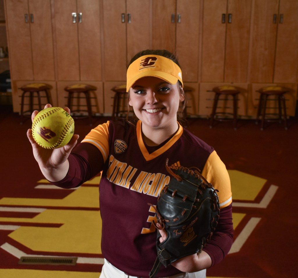 Katie Sexton poses in the CMU Women's Softball Lockerroom in Rose Arena on the campus of Central Michigan University, Sunday, Dec. 4, 2022. This is Katie's third year on the team.