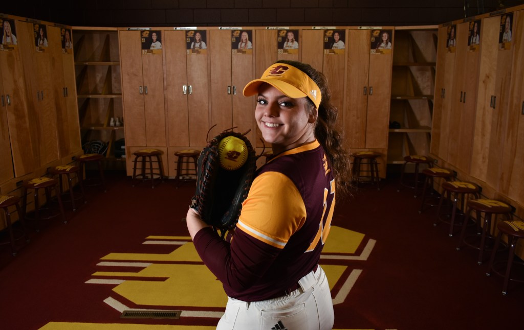 Katie Sexton poses in the CMU Women's Softball Lockerroom in Rose Arena on the campus of Central Michigan University, Sunday, Dec. 4, 2022. This is Katie's third year on the team.