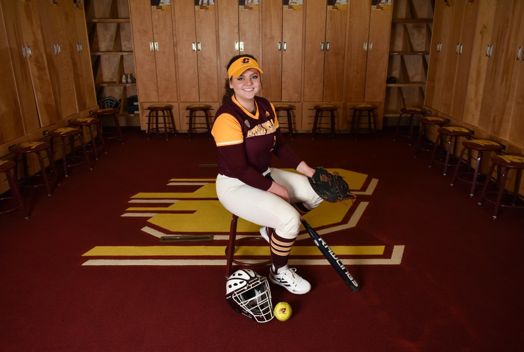 Katie Sexton poses in the CMU Women's Softball Lockerroom in Rose Arena on the campus of Central Michigan University, Sunday, Dec. 4, 2022. This is Katie's third year on the team.