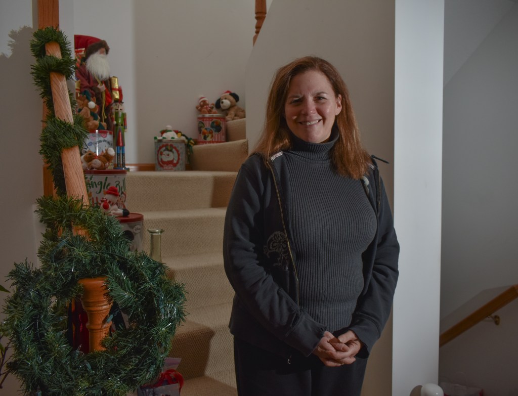 Jody Hassen poses smiles at the camera at her home in Mount Pleasant, MI, on Tuesday, Dec. 13, 2022.