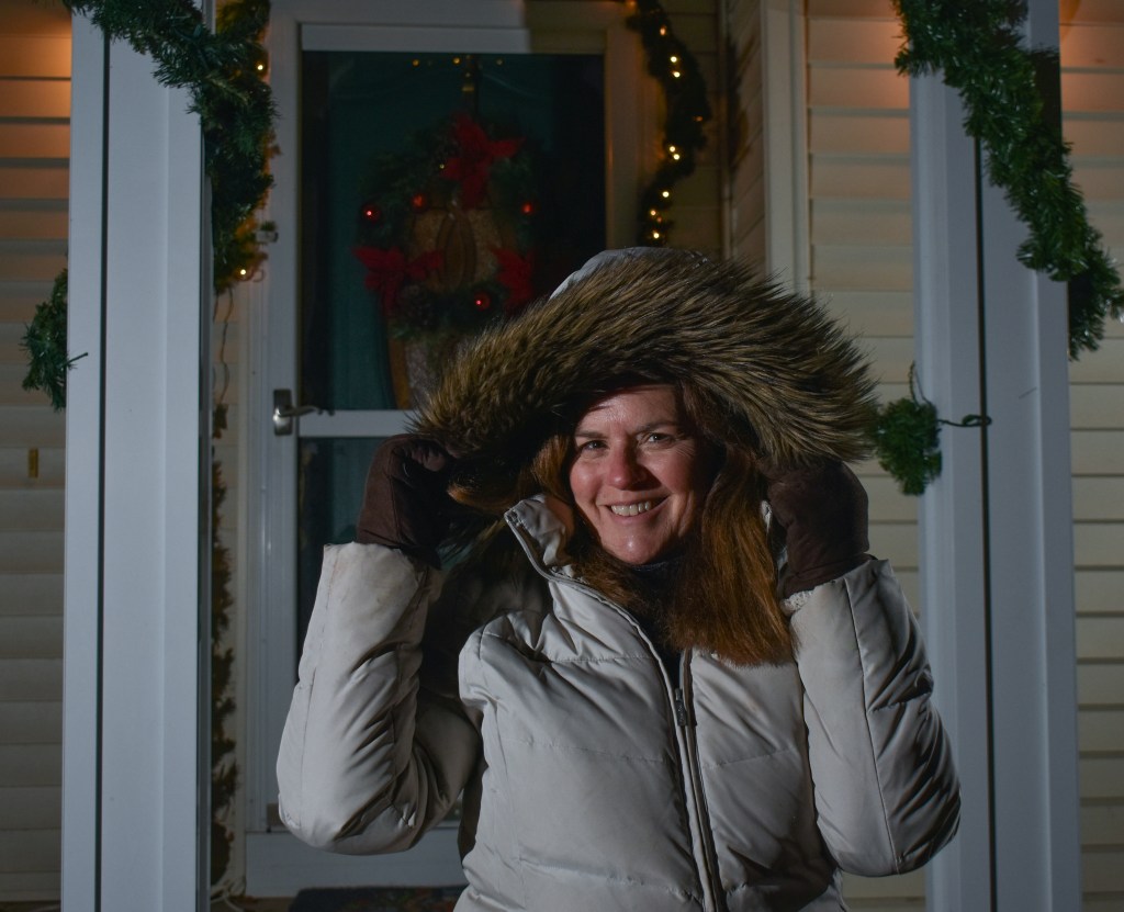 Jody Hassen poses smiles at the camera at her home in Mount Pleasant, MI, on Tuesday, Dec. 13, 2022.